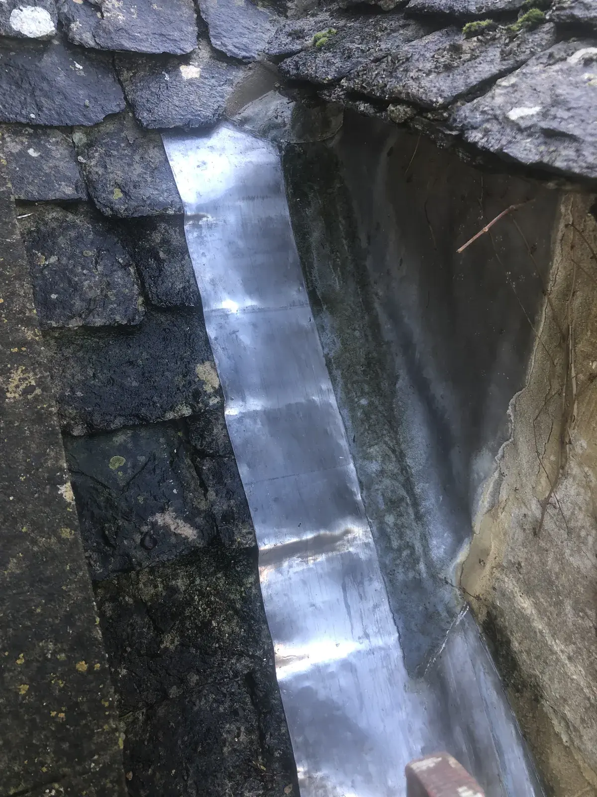 Completed Code 4 leadwork extending from a dormer cheek onto a slate roof
