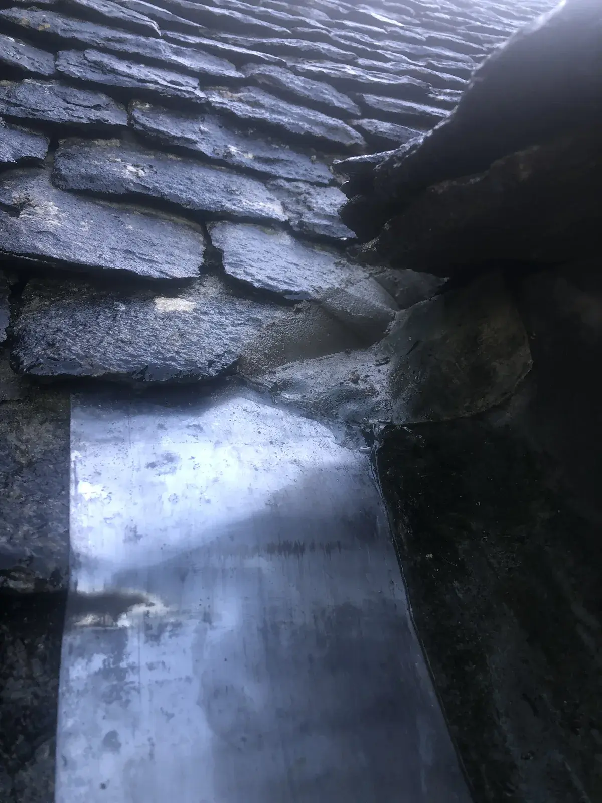 Completed repointing and leadwork at the top of a dormer cheek roof junction