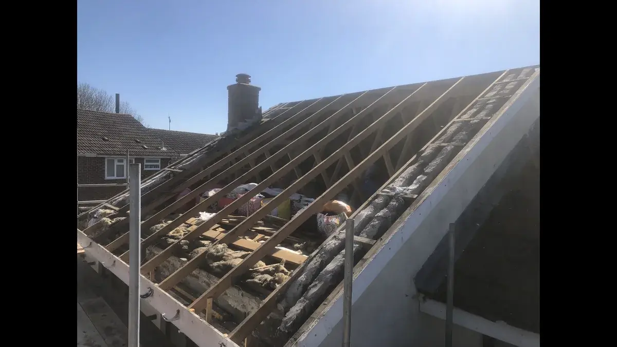 Pitched roof stripped of tiles and battens during a full re-roof