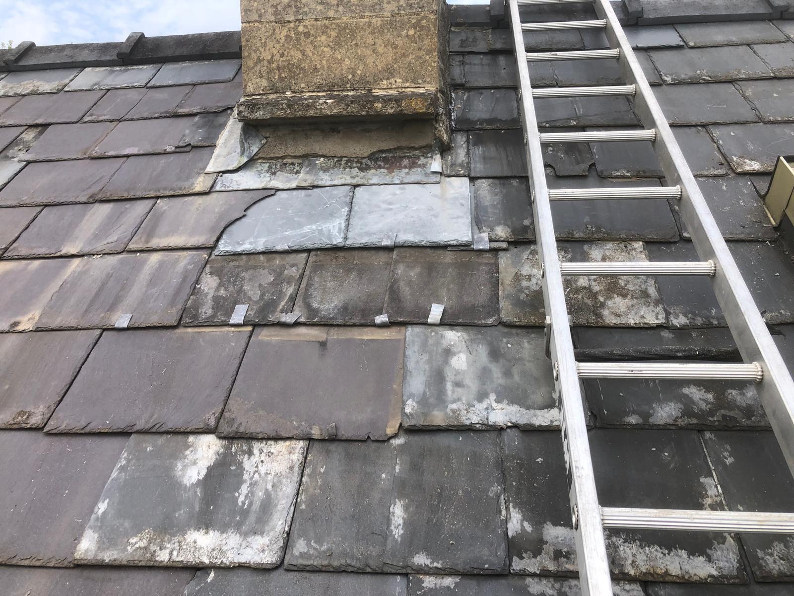 Completed chimney-side repair with two larger Welsh slates
